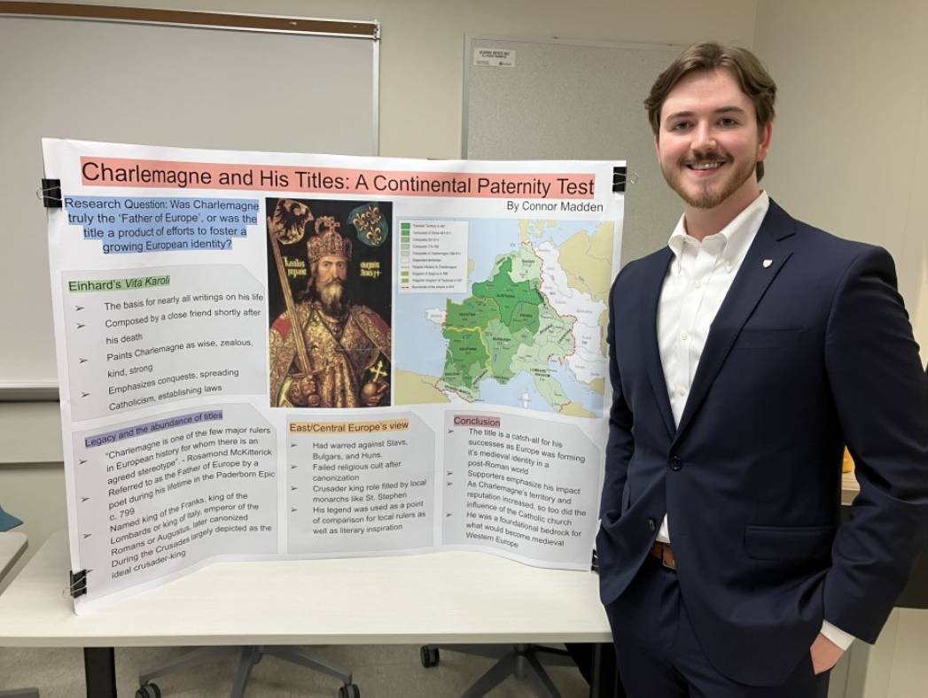 Connor Madden Standing by his Presentation